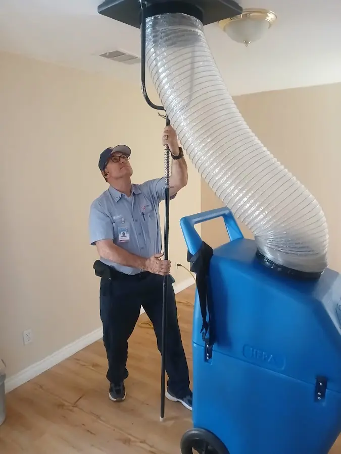 Furnace Tune-Up technician using HEPA equipment in Natchitoches